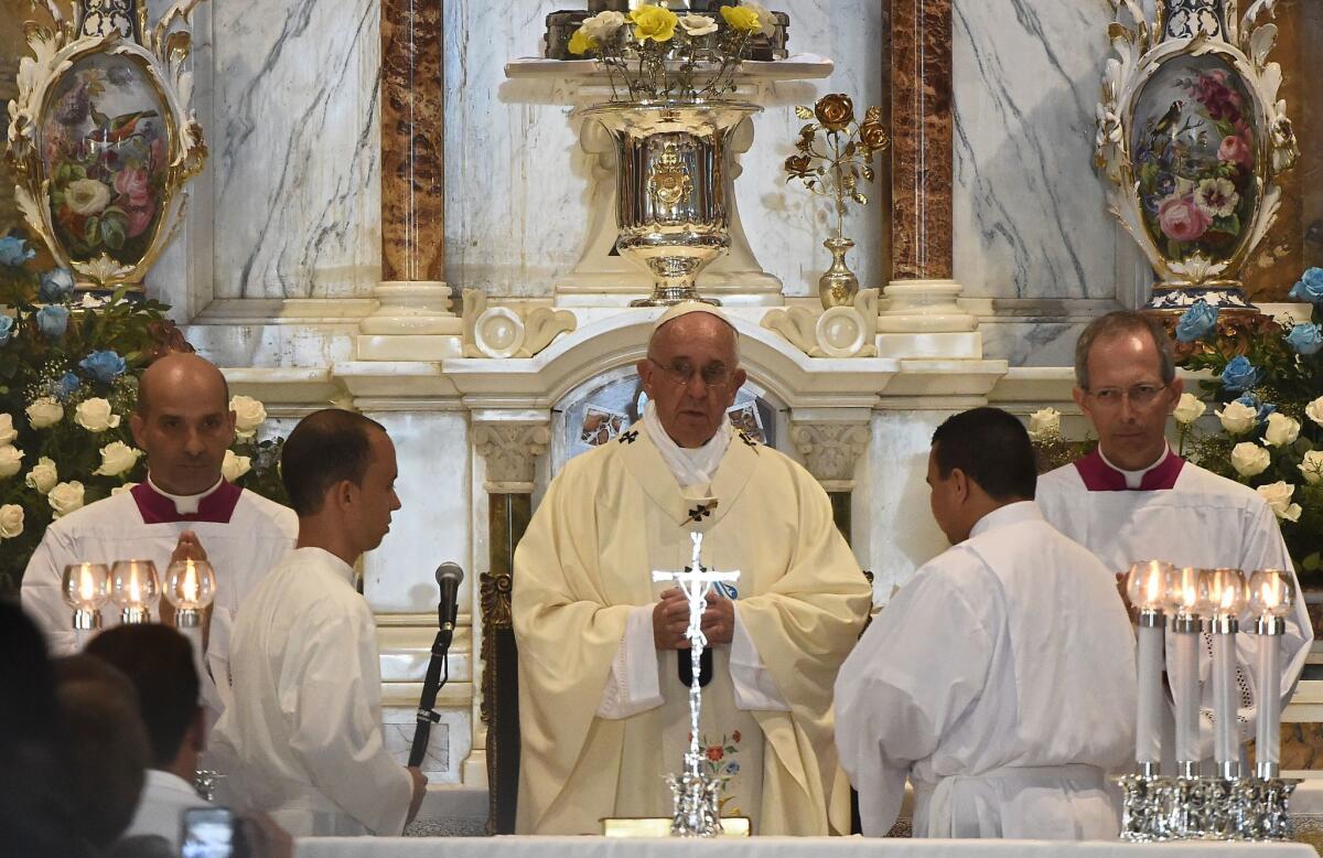 Pope Francis conducts Mass at the basilica to Our Lady of Charity of El Cobre in Santiago de Cuba on Sept. 22.