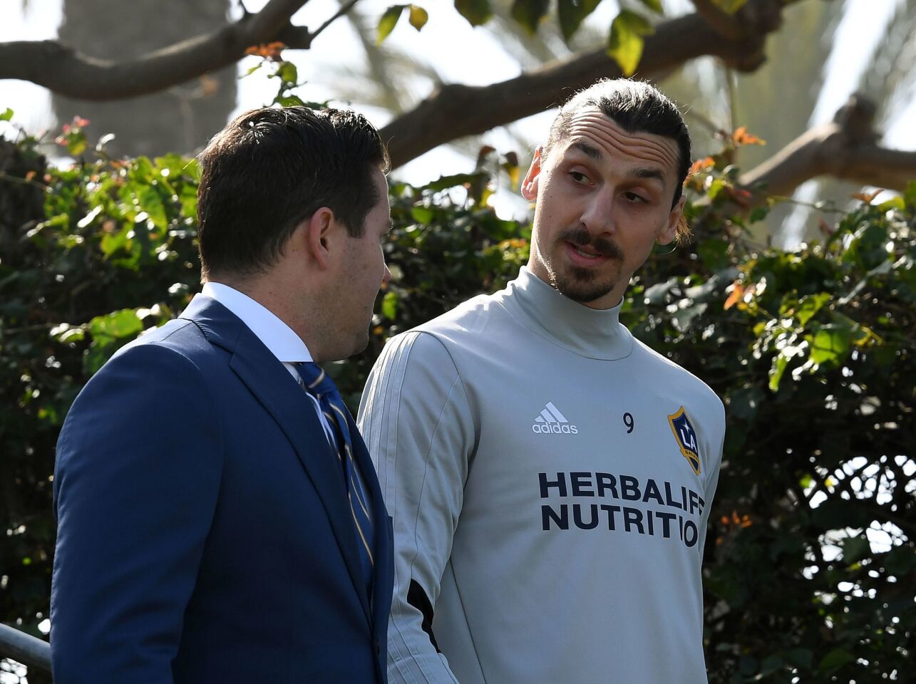 Football star Zlatan Ibrahimovic (R) arrives for his first training session at his new club LA Galaxy in Los Angeles, California, on March 30, 2018. The 36-year-old Swedish striker's move to MLS from Manchester United was confirmed last week, with Ibrahimovic swiftly vowing to reignite the Galaxy's fortunes after they finished bottom of the league last season. / AFP PHOTO / Mark RalstonMARK RALSTON/AFP/Getty Images ** OUTS - ELSENT, FPG, CM - OUTS * NM, PH, VA if sourced by CT, LA or MoD **