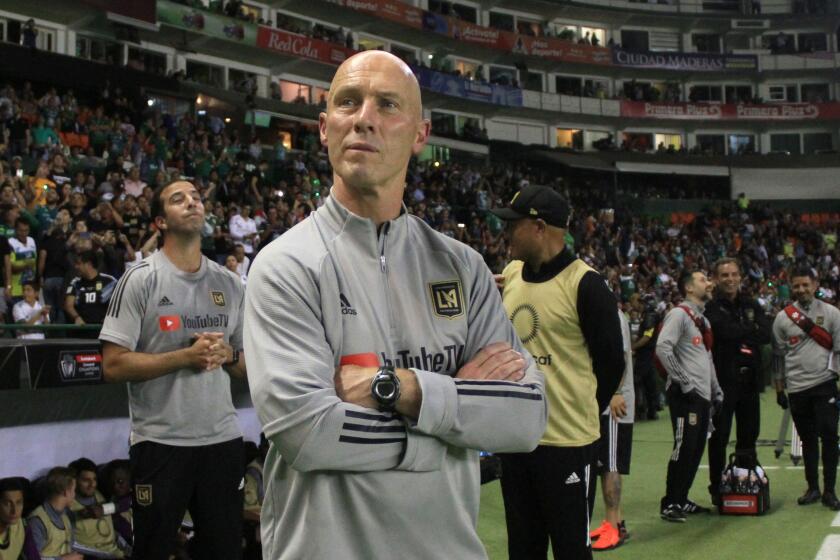 US LAFC coach Bob Bradley watches the match against Mexico´s Leon during the first leg quarterfinal football match of the CONCACAF Champions League at Nou Camp stadium in Leon, Guanajuato state, Mexico on February 18, 2020. (Photo by VICTOR CRUZ / AFP) (Photo by VICTOR CRUZ/AFP via Getty Images)