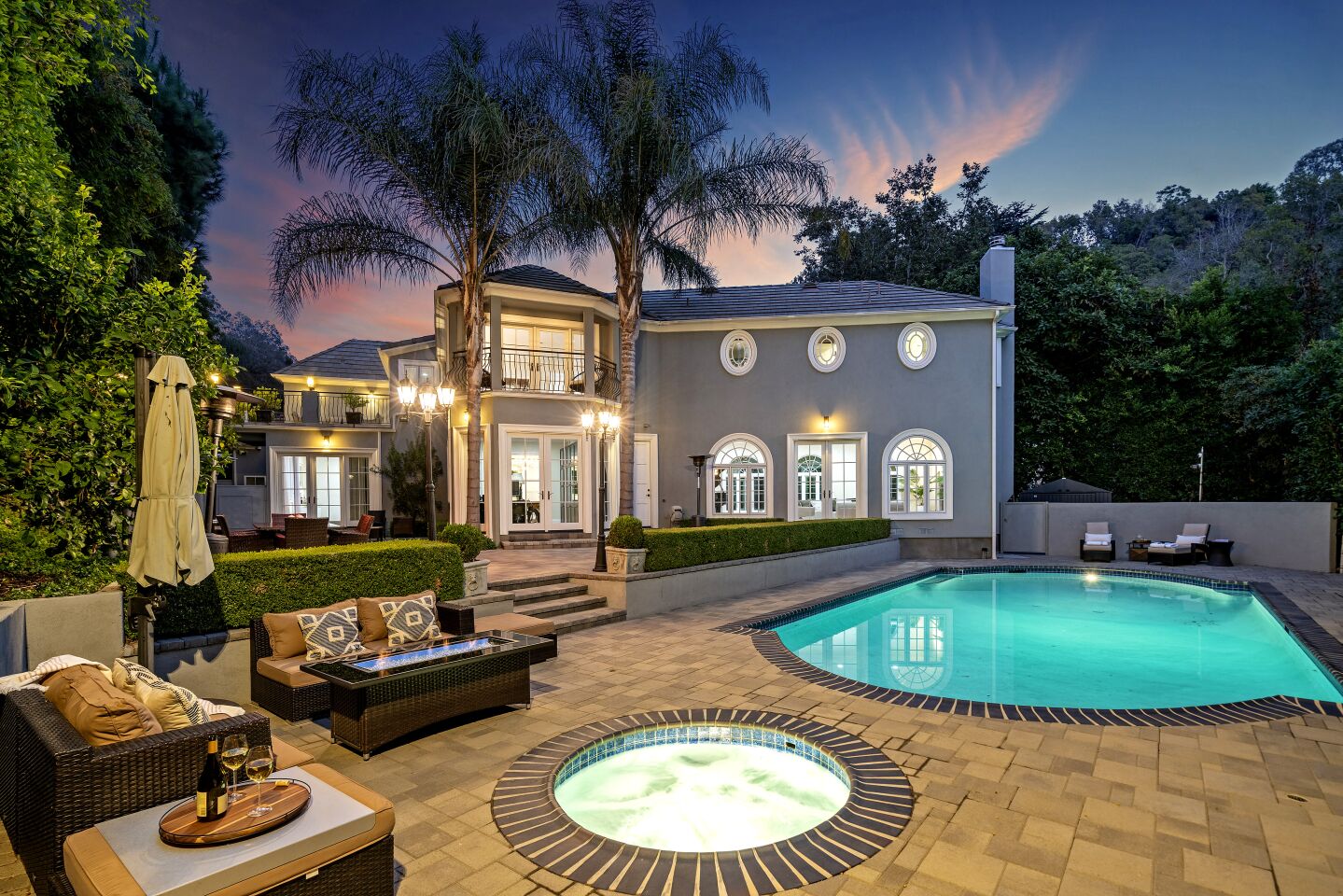 Built in the 1920s for Golden Age of Hollywood actor Errol Flynn, the stylish estate includes a secluded backyard dotted with vintage lampposts and outdoor heaters.