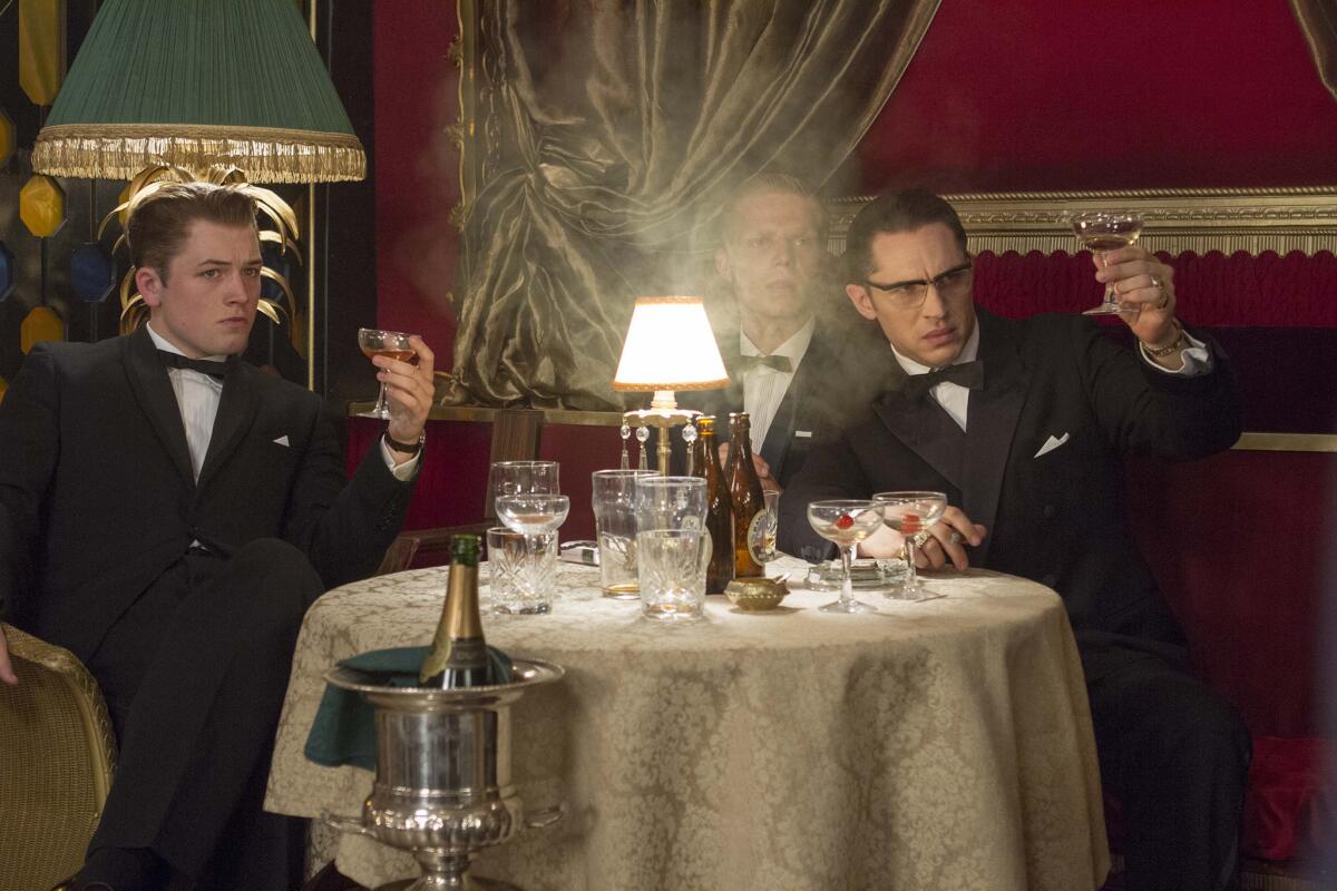 Taron Egerton, Charley Palmer Rothwell and Tom Hardy in "Legend." (Universal Pictures)