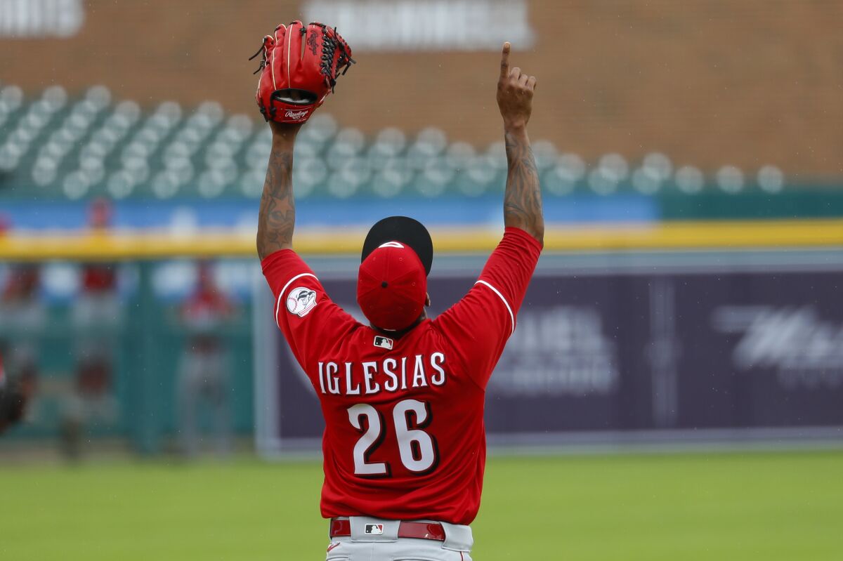 Cincinnati Reds relief pitcher Raisel Iglesias celebrates the final out against the Detroit Tigers in the seventh inning of the first baseball game of a doubleheader in Detroit, Sunday, Aug. 2, 2020. (AP Photo/Paul Sancya)