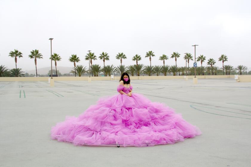 Shay Rose in her 12ft social distancing dress, during a photoshoot at an empty parking lot at the Irvine Spectrum - the only location she could think of that could fit the dress.