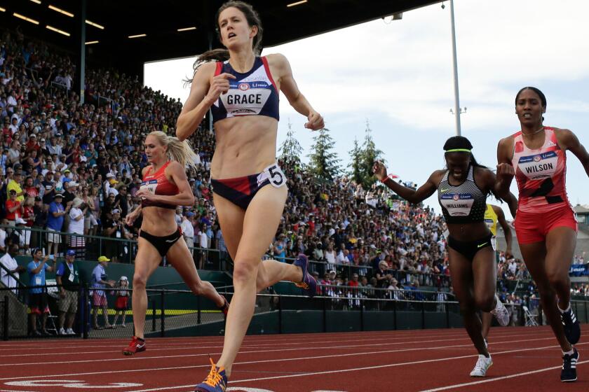Kate Grace wins the women's 800-meter final at the Olympic track and field trials in Eugene, Ore. The International Olympic Committee prevents brands that aren't major sponsors -- such has Grace's apparel provider, Oiselle -- from referring to the Olympics in ads.
