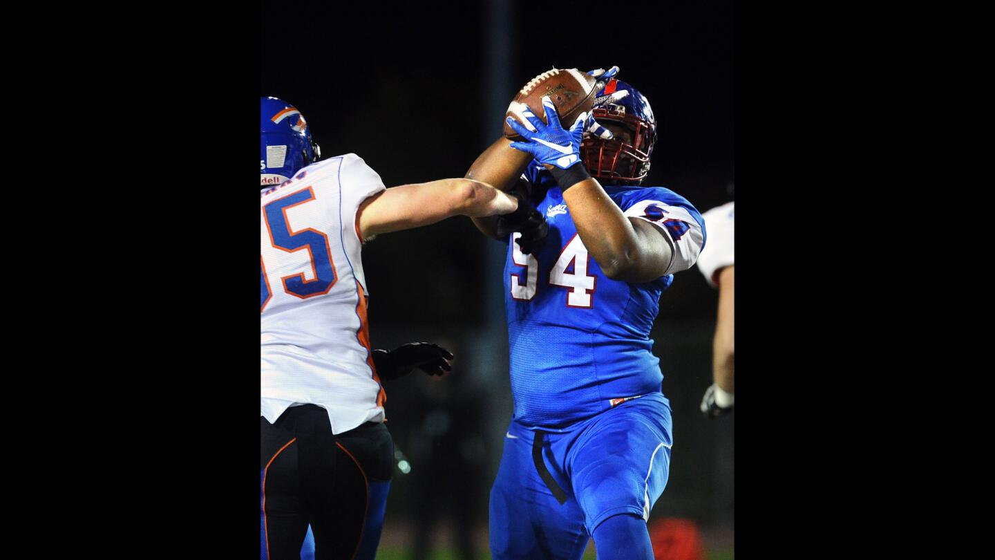 Serra defensive lineman Kordell Ross intercepts a pass in front of Westlake's Zach Vournas in the first quarter.