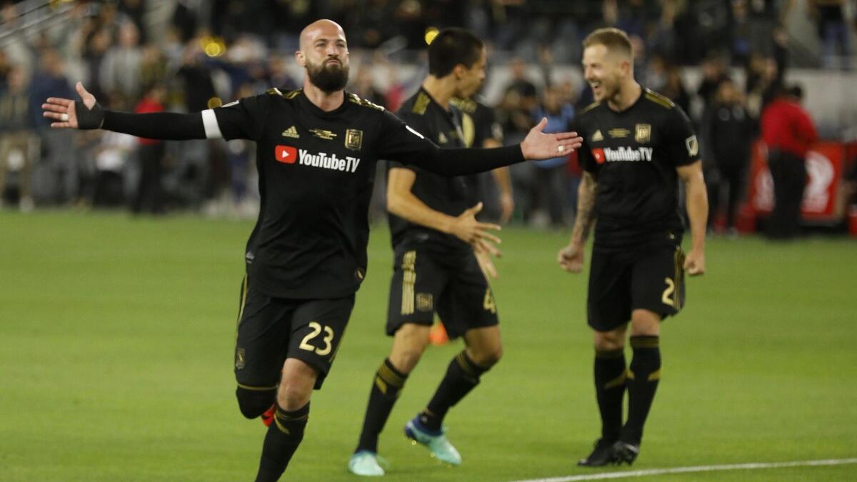 Laurent Ciman acknowledges cheers from the crowd after scoring the game-winning goal against the Seattle Sounders in LAFC's first game at Banc of California Stadium.