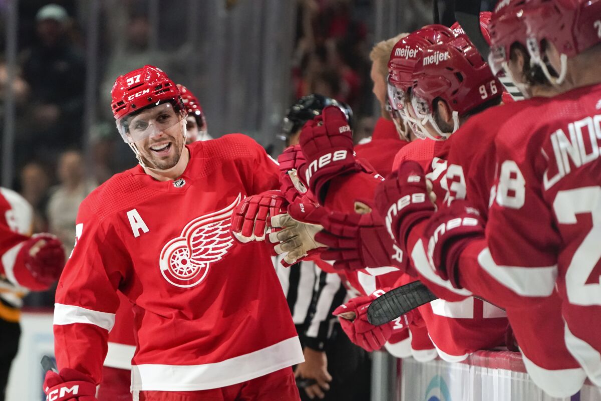 Detroit Red Wings left wing David Perron (57) celebrates his goal against the Pittsburgh Penguins in the third period of an NHL hockey game Tuesday, March 28, 2023, in Detroit. (AP Photo/Paul Sancya)
