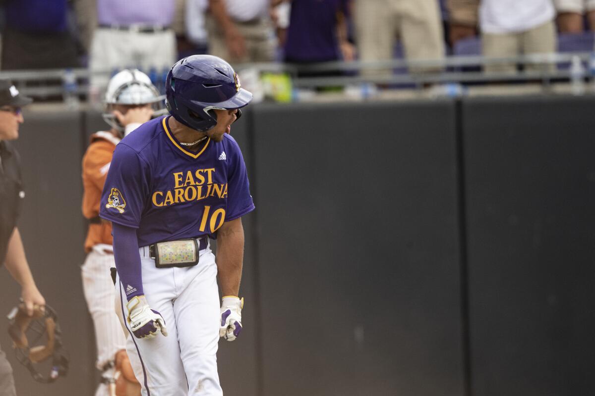East Carolina's Jacob Starling reacts to hitting a home run during the ninth inning of an NCAA college super regional baseball game against Texas on Saturday, June 11, 2022, in Greenville, N.C. (AP Photo/Matt Kelley)