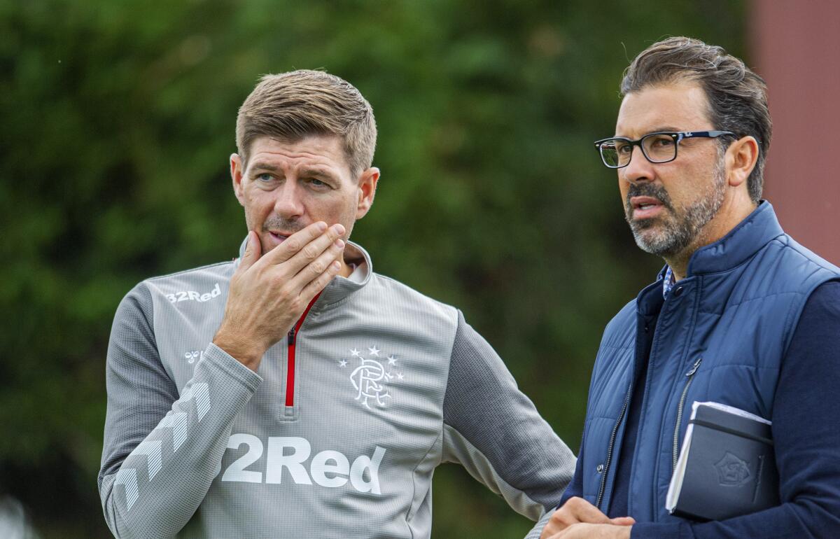 Galaxy technical director Jovan Kirovski joins Rangers manager Steven Gerrard to watch a training session