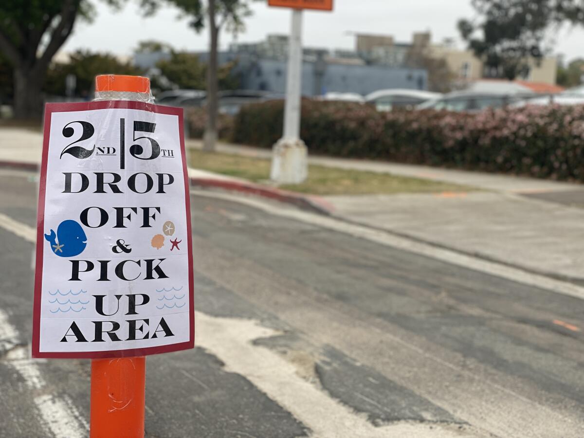 Signs at La Jolla Elementary School direct different grade levels to different entry points.