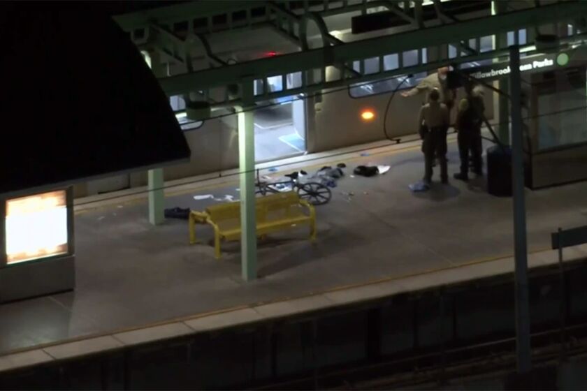 Investigators respond to a Willowbrook Metro station where four people were injured in a shooting on Sept. 24, 2021. (KTLA)