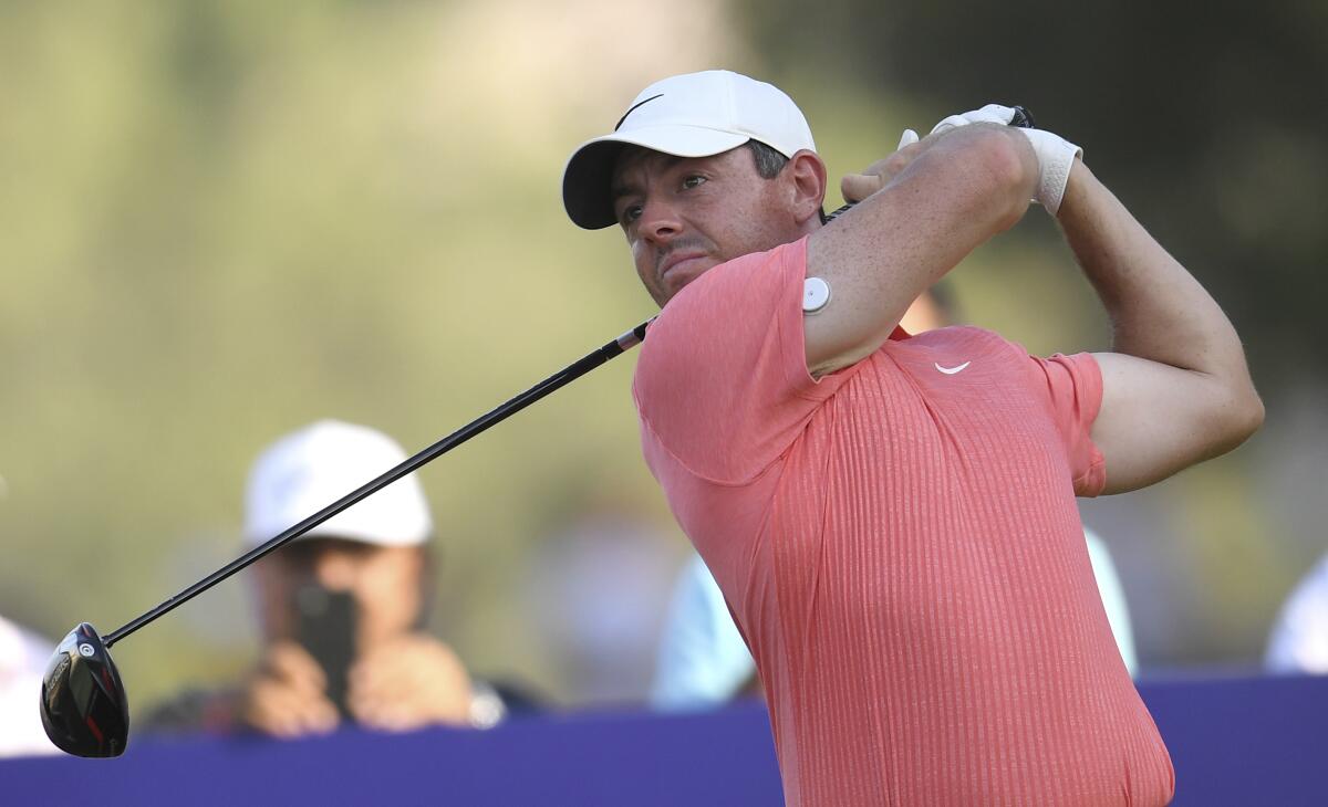 FILE - Rory McIlroy of Northern Ireland tees off at the 18th hole during DP World Tour Championship in Dubai, United Arab Emirates, on Nov. 19, 2022. McIlroy was one of the most vocal critics of the LIV Golf breakaway league last year. It left him feeling mentally drained so he decided to put his clubs away for a few weeks around Christmas. Now he’s back and appears to be as fiery as ever as he prepares to play the Dubai Desert Classic. (AP Photo/Martin Dokoupil, File)