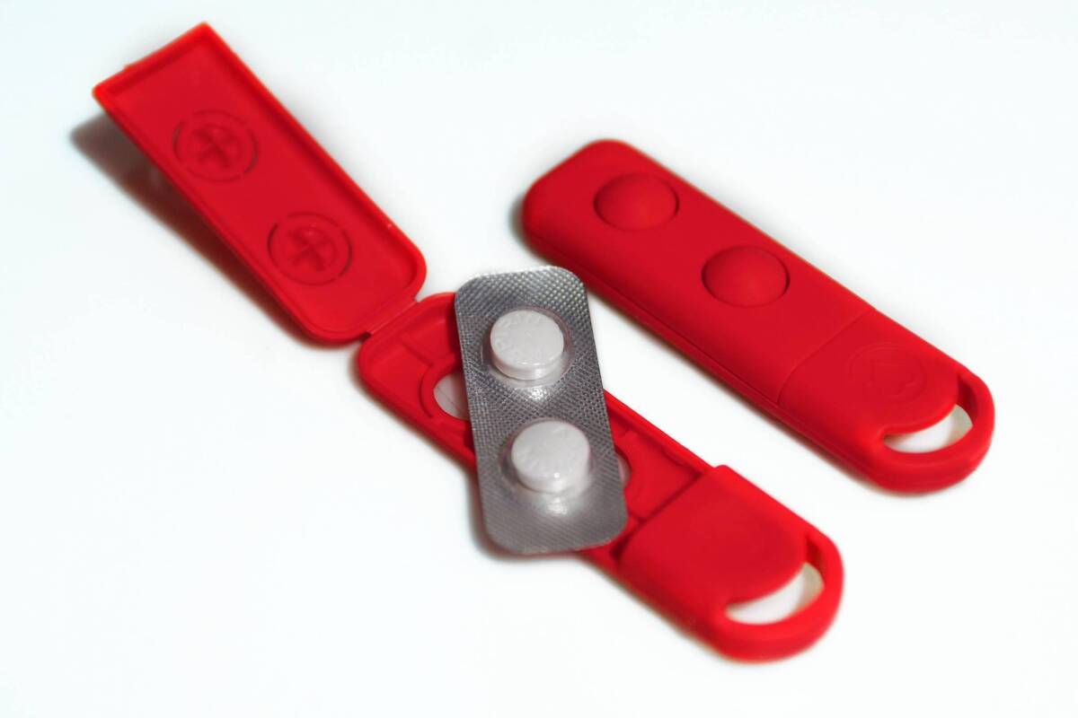 The little red packet with aspirin can be kept on a key chain to be used in case of a heart attack.