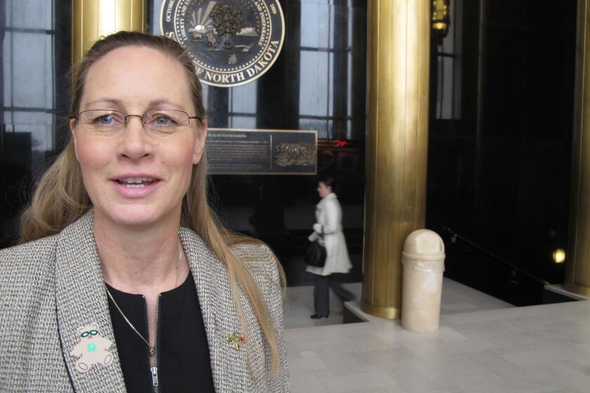 Bette Grande, a state representative in North Dakota, talks to reporters after the state Senate passed a bill banning abortions when a fetal heartbeat is detected. It would be the nation's most restrictive abortion law.