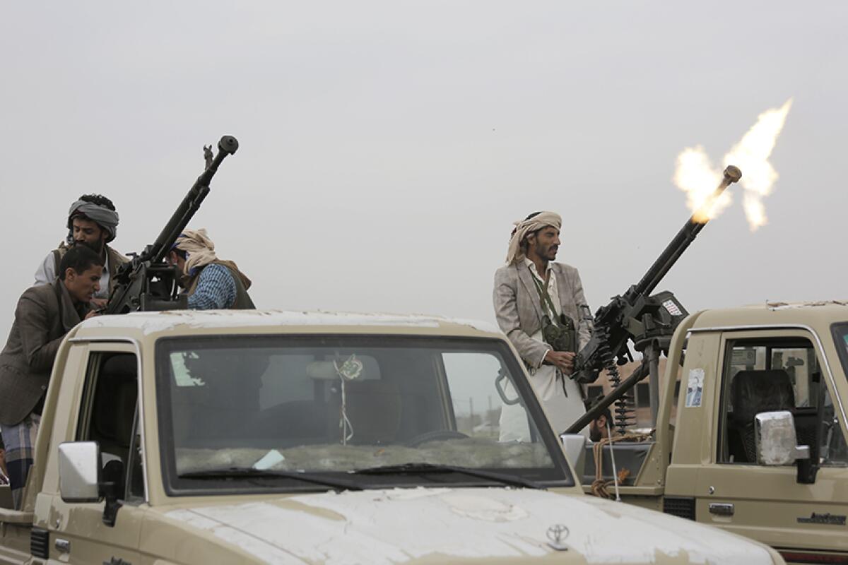 A Houthi fighter fires in the air during a gathering in Sana, Yemen, in 2018.