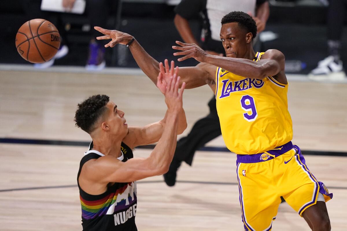 Lakers guard Rajon Rondo, right, passes over Denver Nuggets forward Michael Porter Jr. during Game 4.