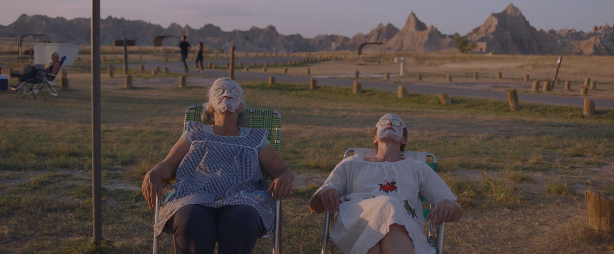"Nomadland's" Linda May and Frances McDormand relax outdoors wearing moisturizing cream.