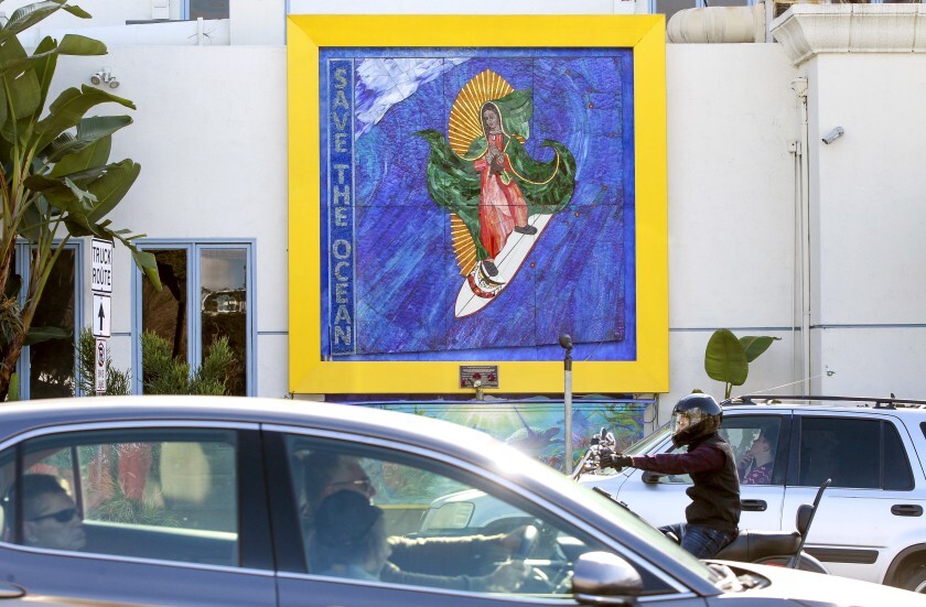 The “Surfing Madonna” mosaic displayed on Encinitas Boulevard, near the Coast Highway intersection, in Encinitas.