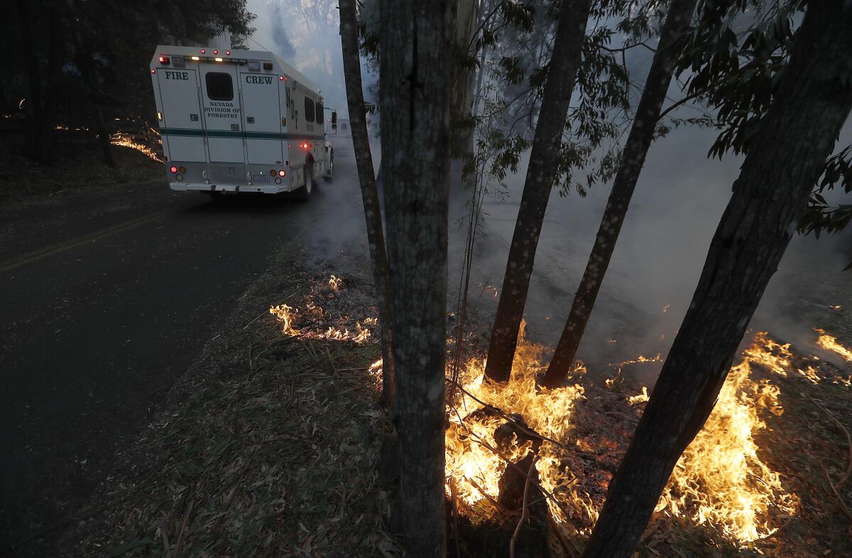 Spot fires within the Kincade fire line Chalk Hill Road near Healdsburg, Calif., on Sunday.