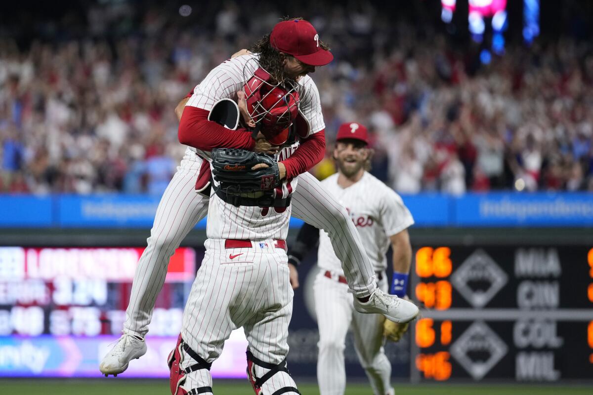 Phillies pitcher Michael Lorenzen, left, and J.T. Realmuto celebrate after Lorenzen completed a no-hitter.