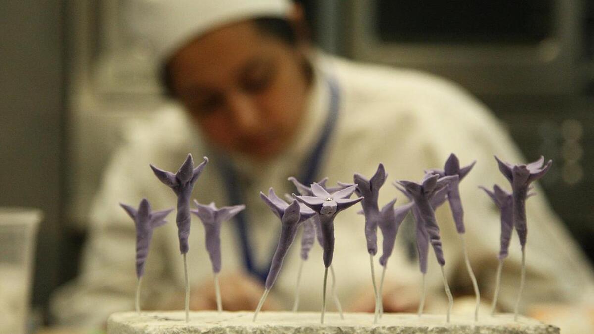 A culinary student works on cake decorating at a Le Cordon Bleu class in Pasadena.