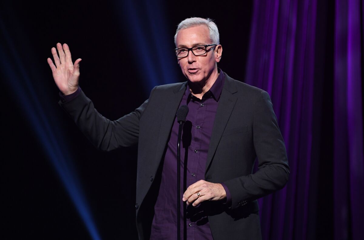 Drew Pinsky speaks onstage at the 2019 iHeartRadio Podcast Awards Presented