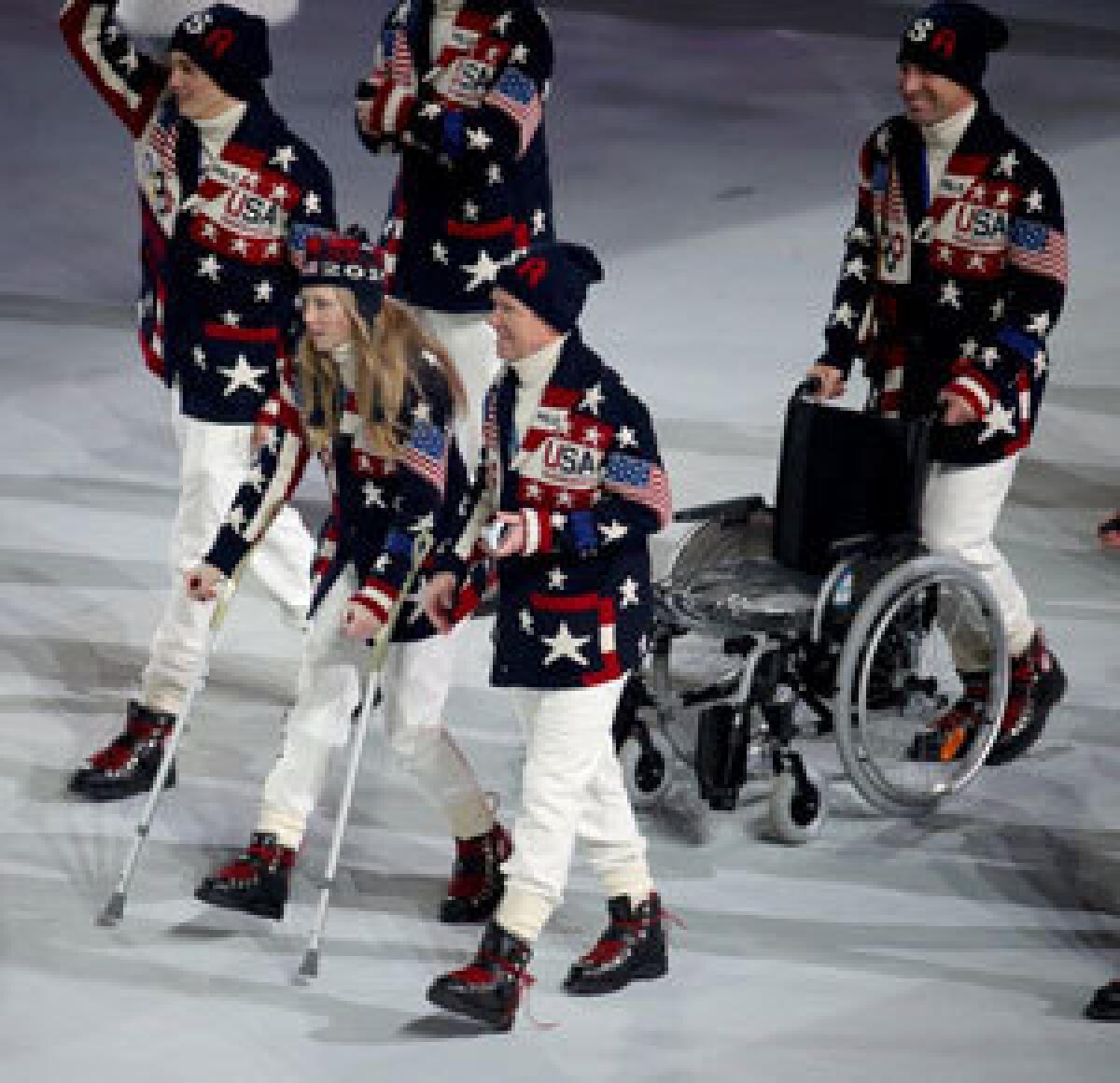 Heidi Kloser uses crutches to take part in the opening ceremony.