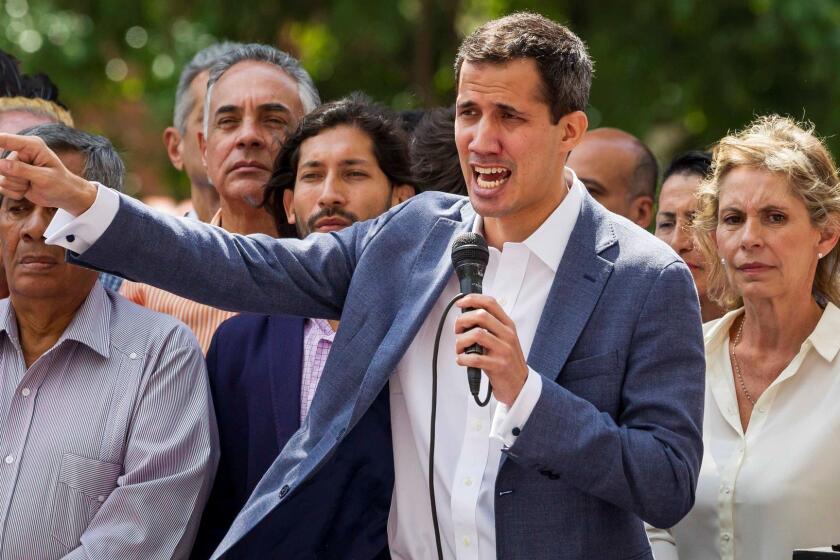 Mandatory Credit: Photo by MIGUEL GUTIERREZ/EPA-EFE/REX (10054630a) President of the Venezuelan National Assembly Juan Guaido (C) participates in a protest to denounce the 'illegitimacy' of Nicolas Maduro's Government, in Caracas, Venezuela, 11 January 2019. President of the Venezuelan National Assembly Juan Guaido demanded the support of citizens, members of the military and the international community to take control of the Executive. Hundreds protest against the 'illegitimacy' of Nicolas Maduro's Government in Venezuela, Caracas - 11 Jan 2019 ** Usable by LA, CT and MoD ONLY **