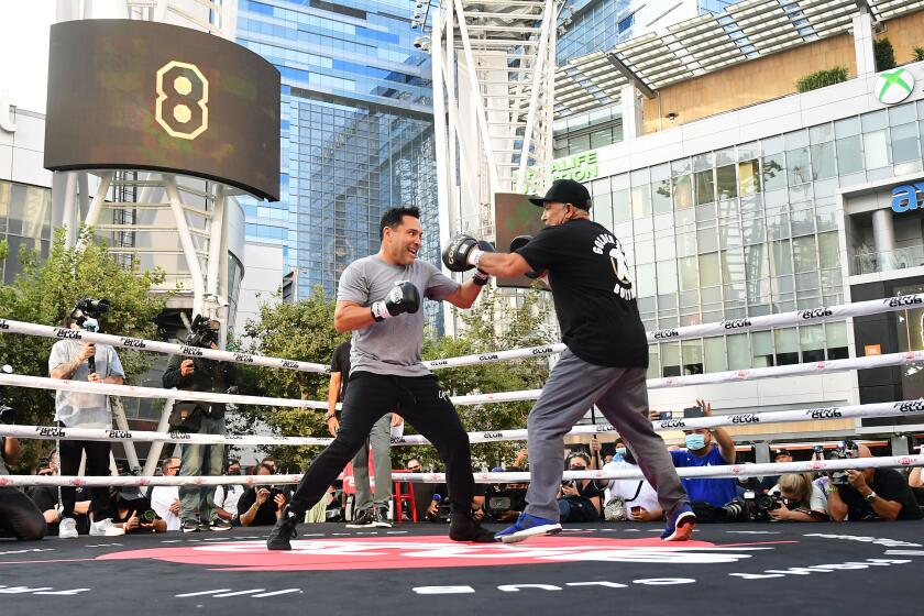 Former US Olympics Gold medalist professional boxer Oscar De La Hoya (L) spars with his partner during a public media workout in Los Angeles, California on August 24, 2021. - De La Hoya will face former UFC figher Vitor Belfort at Staples Center in Los Angeles on September 11. (Photo by Frederic J. BROWN / AFP) (Photo by FREDERIC J. BROWN/AFP via Getty Images)