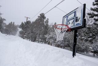 SUGARLOAF, CA - MARCH 01: Many streets are deserted as snow trapped residents in their homes and kept visitors away from resort areas in the San Bernardino Mountains where successive storms dumped more snow than has been seen in years on Wednesday, March 1, 2023 in Sugarloaf, CA. (Brian van der Brug / Los Angeles Times)