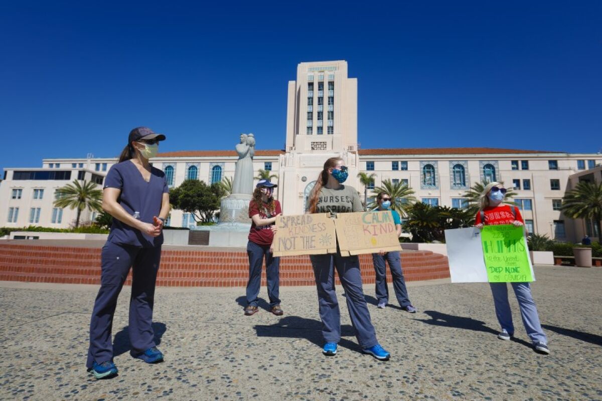 A small group of medical professionals demonstrated in front of the San Diego County Administration building on the Embarcadero in downtown San Diego on Saturday. They wanted to remind people to not become complacent with the novel coronavirus pandemic.