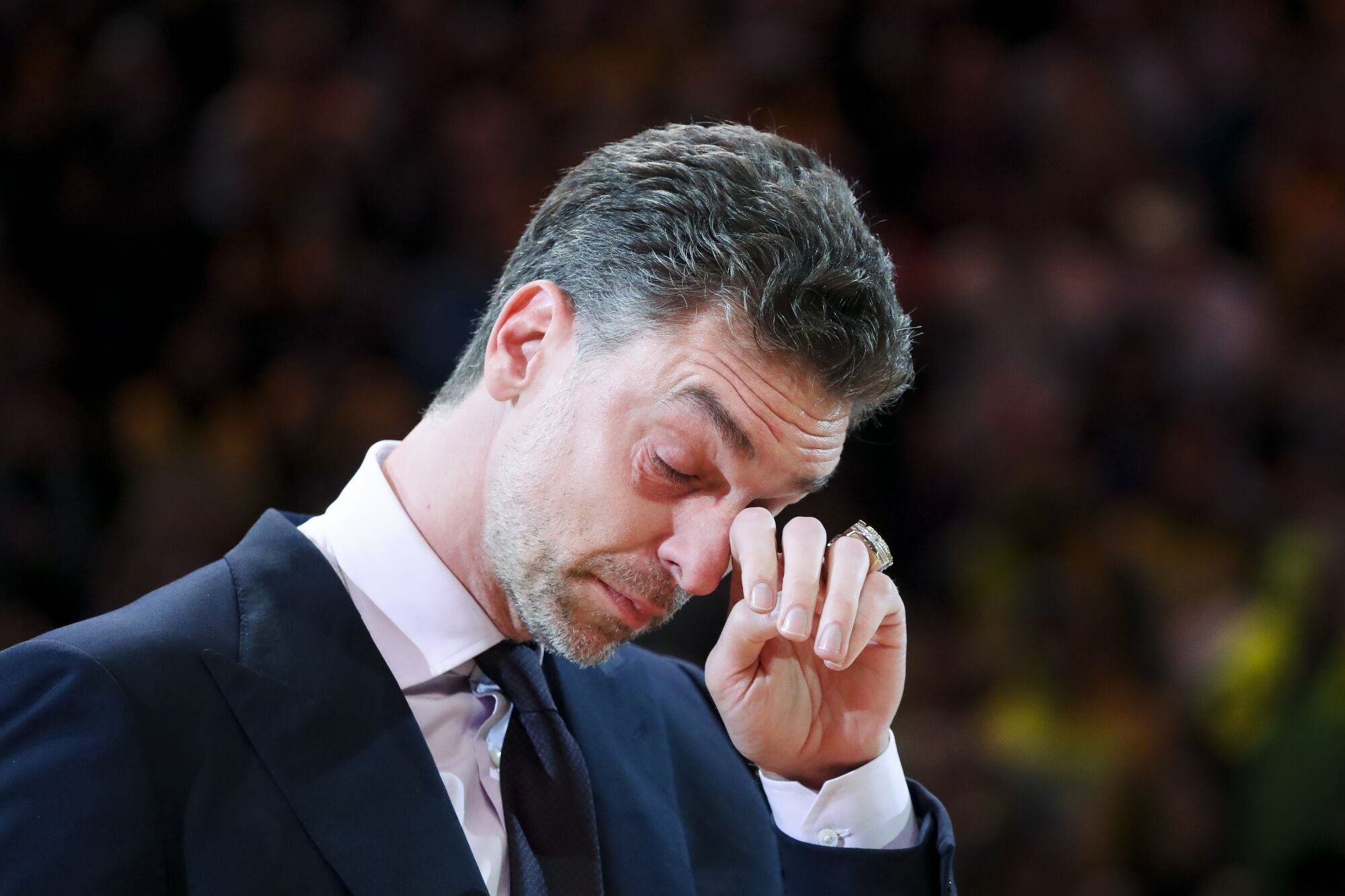 Pau Gasol wipes away tears after retiring his jersey during Tuesday's halftime ceremony.