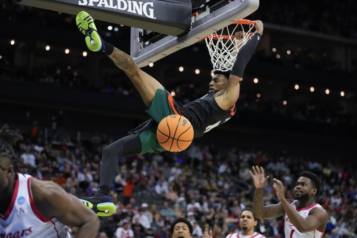 Miami guard Jordan Miller dunks against Houston in the first half of a Sweet 16 game March 24, 2023.