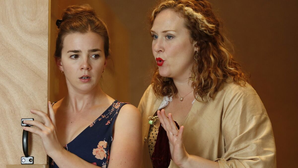 Sarah Shafer, left, and Caitlin Lynch rehearse a scene from San Diego Opera's season-opening production of Wolfgang Amadeus Mozart's "The Marriage of Figaro."
