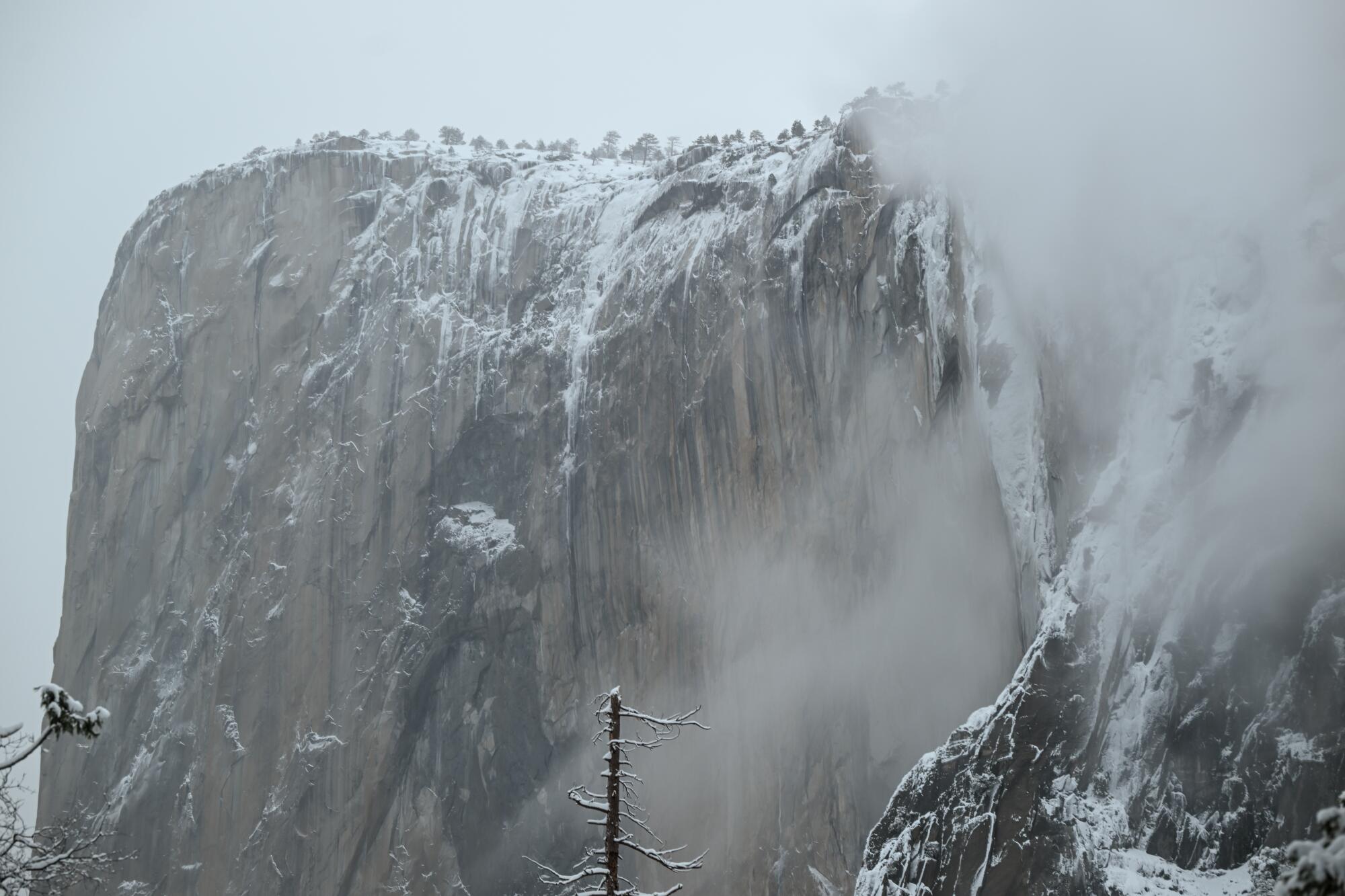 A view of El Capitan shrouded in the clouds inside Yosemite National Park.