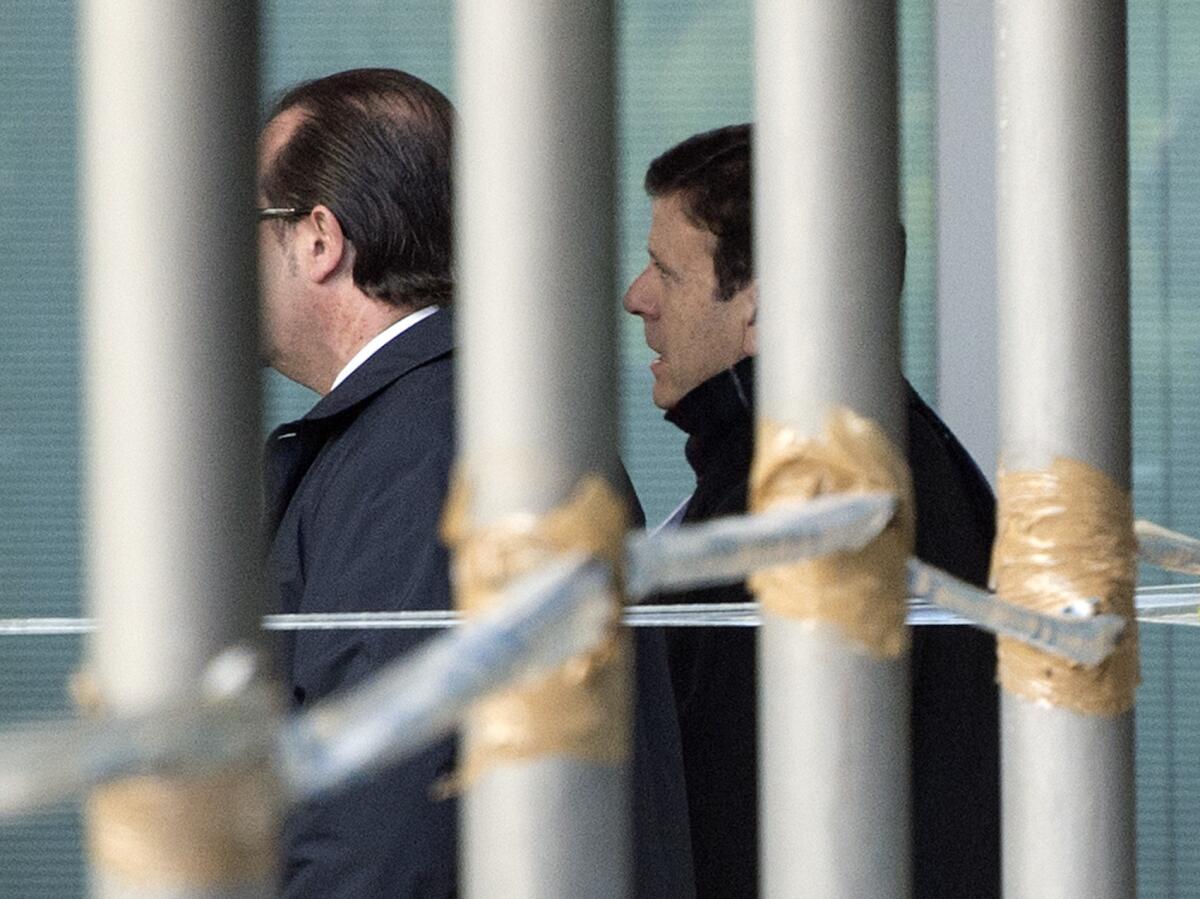 Dr. Eufemiano Fuentes, right, arrives at a courthouse in Madrid on Jan. 28, 2013. Fuentes operated a doping ring in which several top cyclists were involved.