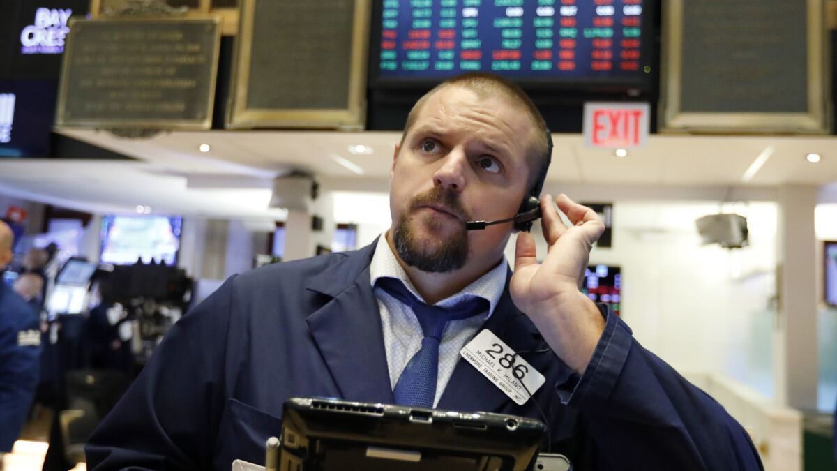 A trader works on the floor of the New York Stock Exchange on Sept. 14.