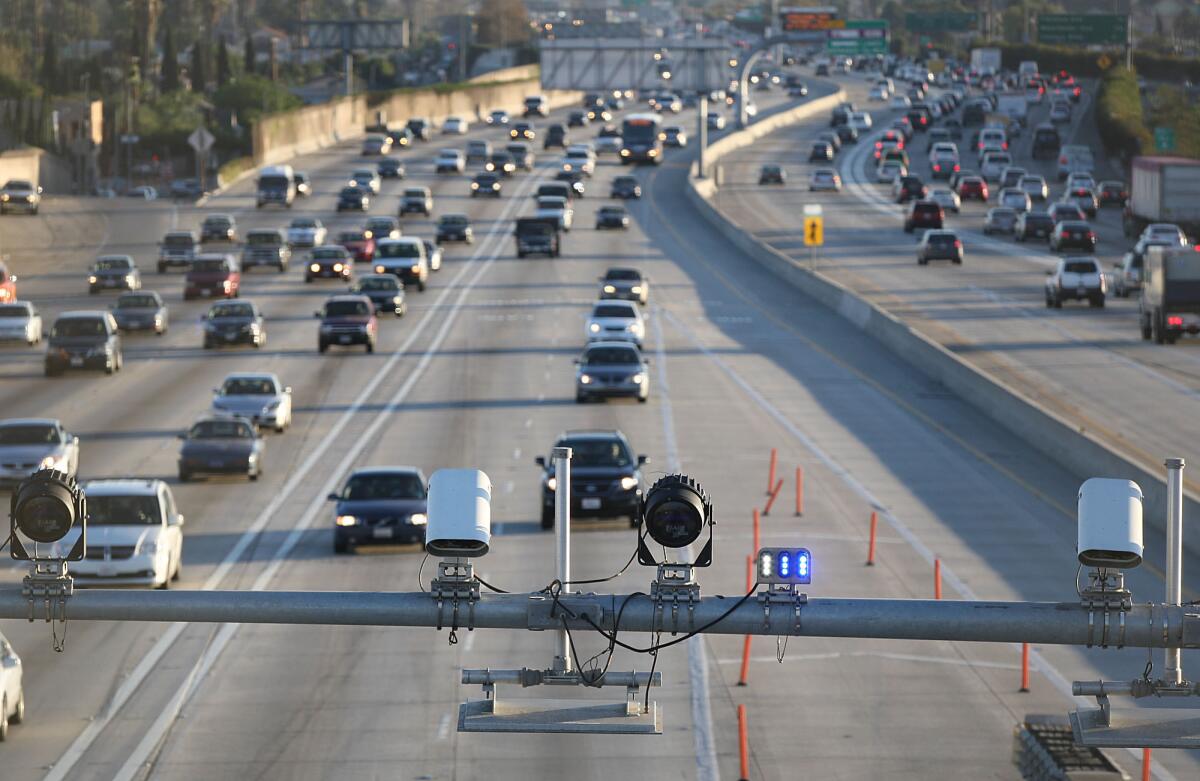 Cameras and electronic sensors preside over the 110 Freeway's toll lanes.