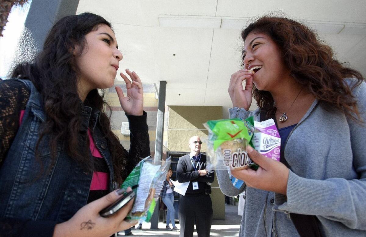 Students with snacks from the school store at Miguel Contreras High School in Los Angeles.