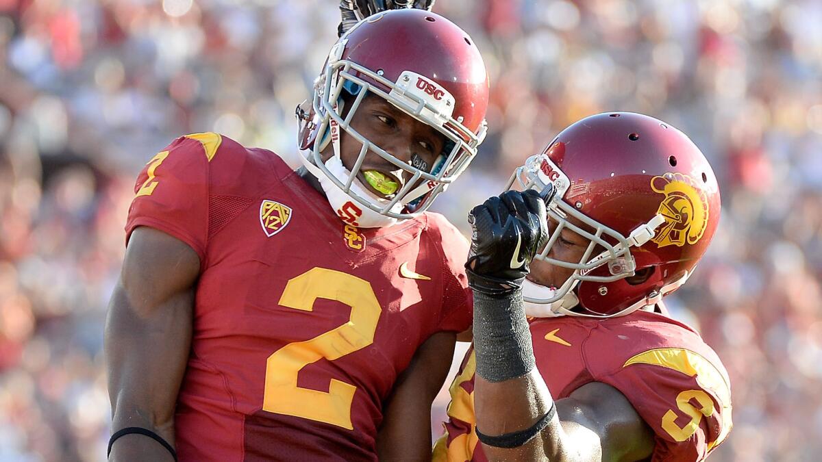 USC's Adoree' Jackson, left, celebrates a touchdown catch with teammate Juju Smith during the Trojans' season opener against Fresno State on Aug. 30.