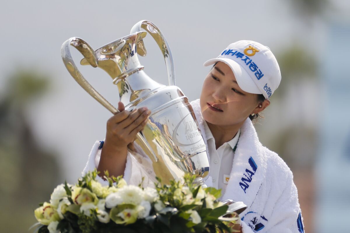 Mirim Lee holds the championship trophy after winning the LPGA ANA Inspiration.