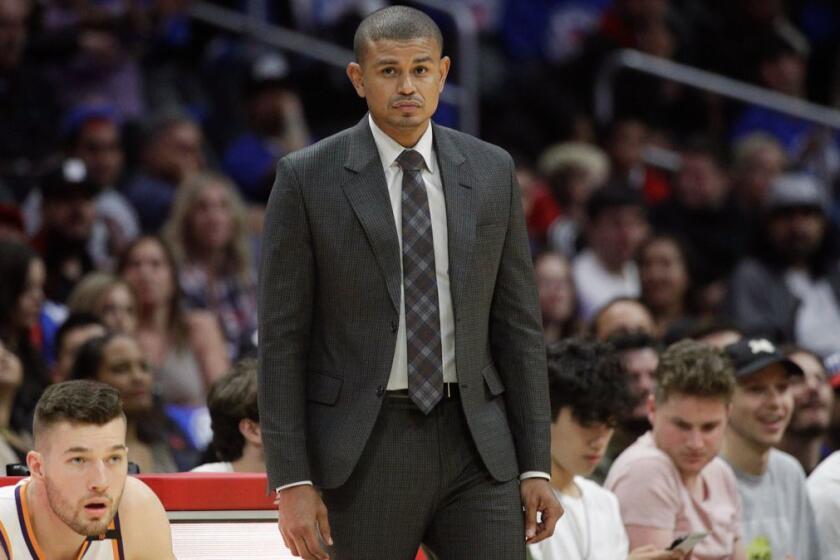 In this Oct. 21, 2017, photo, Phoenix Suns head coach Earl Watson watches action during the second half of an NBA basketball game against the Los Angeles Clippers in Los Angeles. The Suns have fired coach Watson just three games in to the NBA season. Phoenix announced the firing Sunday night, Oct. 22, after hours of meetings at the team's headquarters. (AP Photo/Jae C. Hong)
