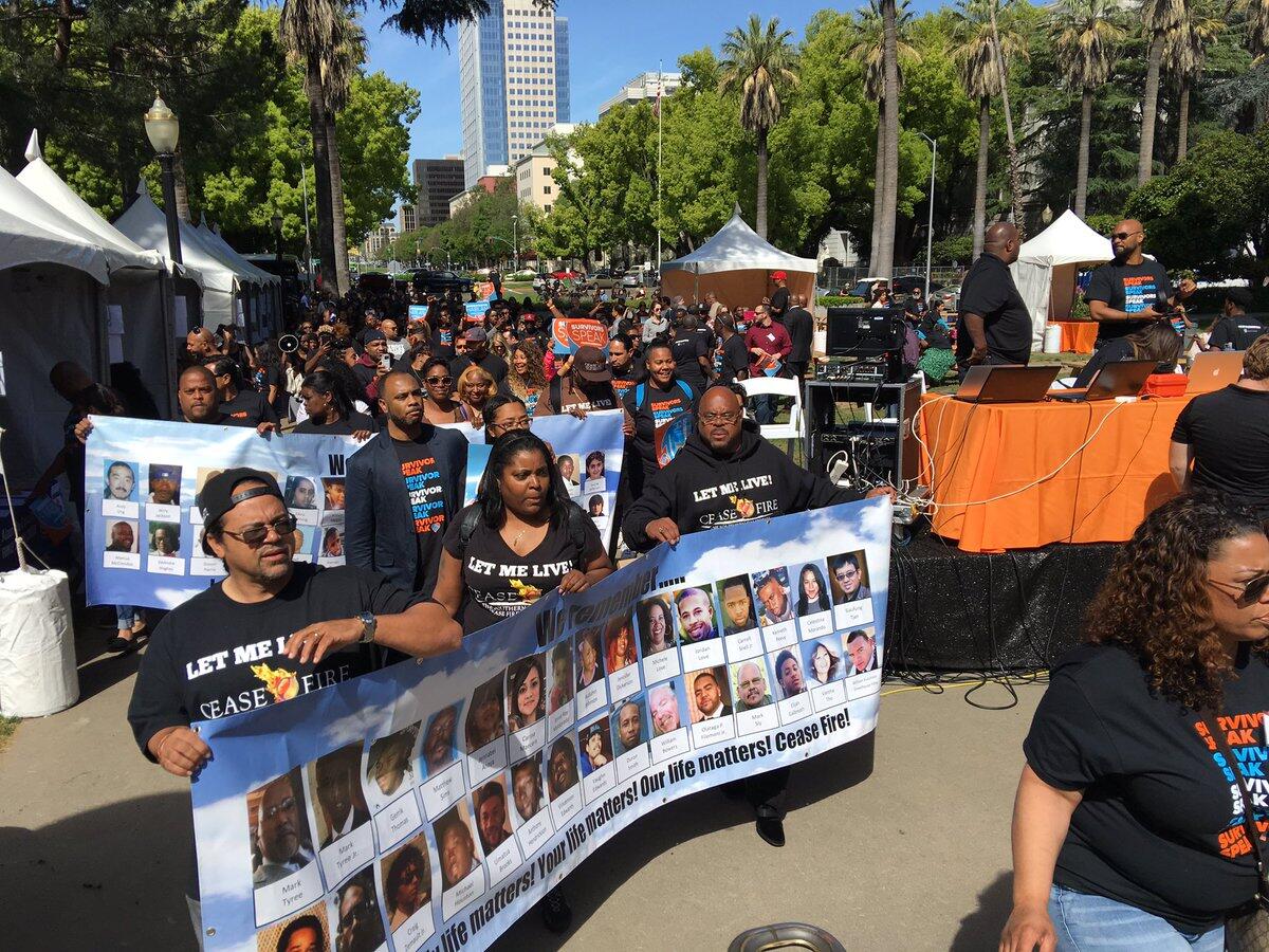 Crime survivors march toward the state Capitol.