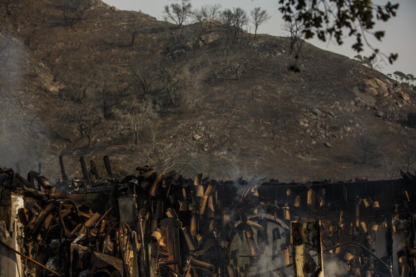 A view of the charred landscape and the falling spanish tiles of a home that was destroyed by the Thomas Fire in Montecito, Calif., on Dec. 17, 2017.