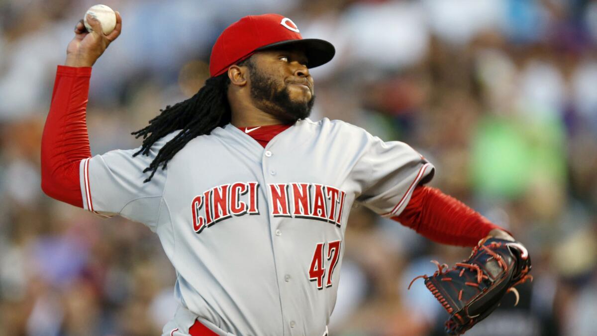 Cincinnati Reds starter Johnny Cueto delivers a pitch during a game against the Colorado Rockies on Saturday.