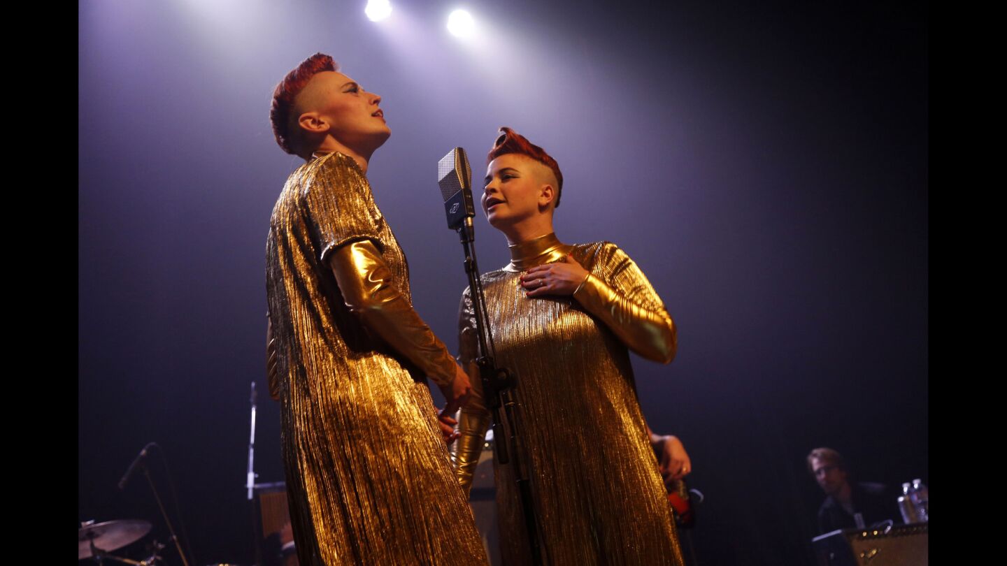 Jess Wolfe and Holly Laessig of Lucius, dressed in matching gold gowns, perform "I Don't Want to Know."