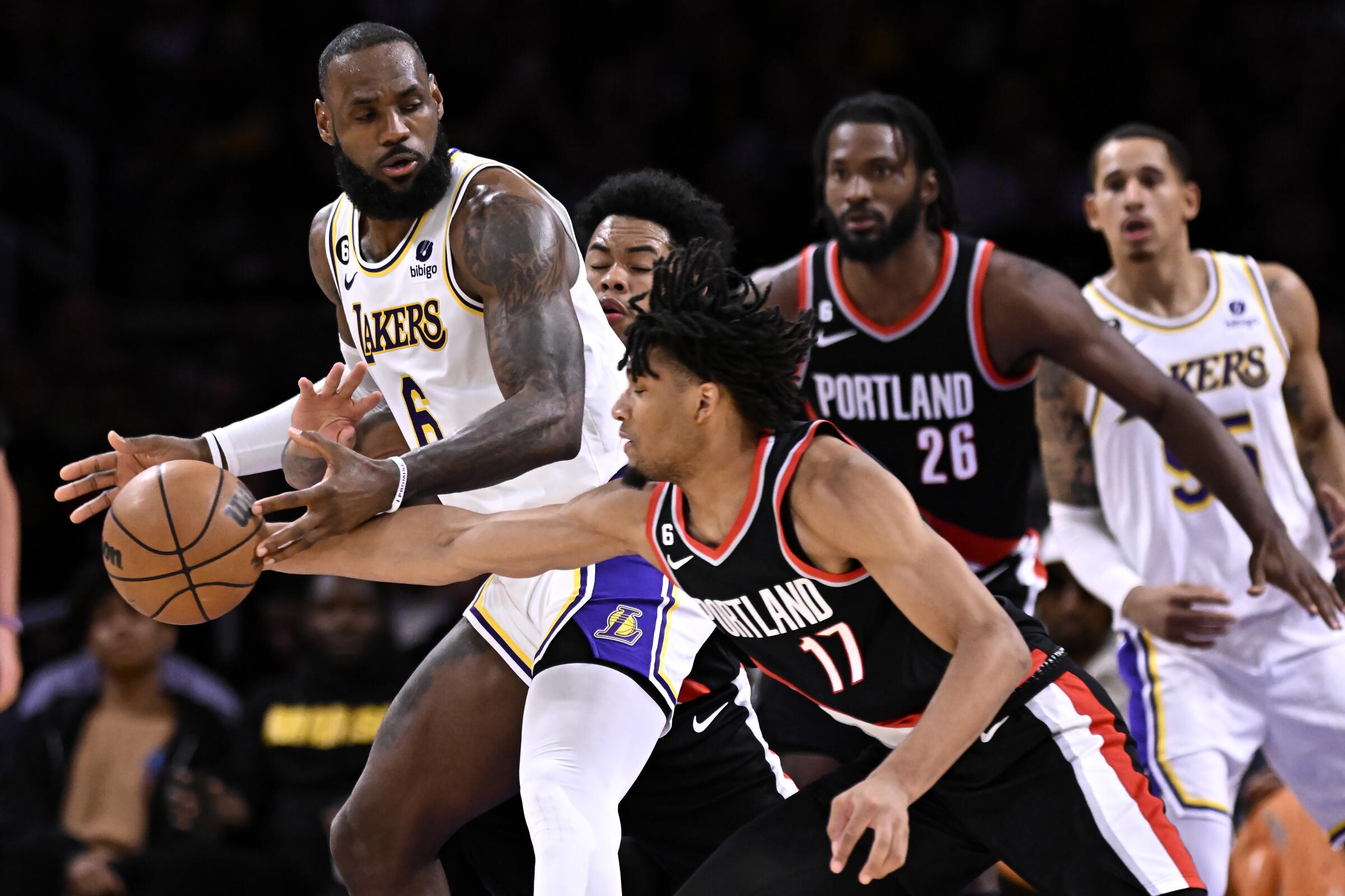 Portland Trail Blazers guard Shaedon Sharpe steals the ball away from Lakers star LeBron James.