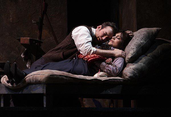 Stephen Costello (Rodolfo) and Ailyn Pérez (Mimi) in the death scene of LA Opera's Herbert Ross production of "La Boheme" at the Dorothy Chandler Pavilion. Conductor Patrick Summers, of Houston Grand Opera, makes his company debut.