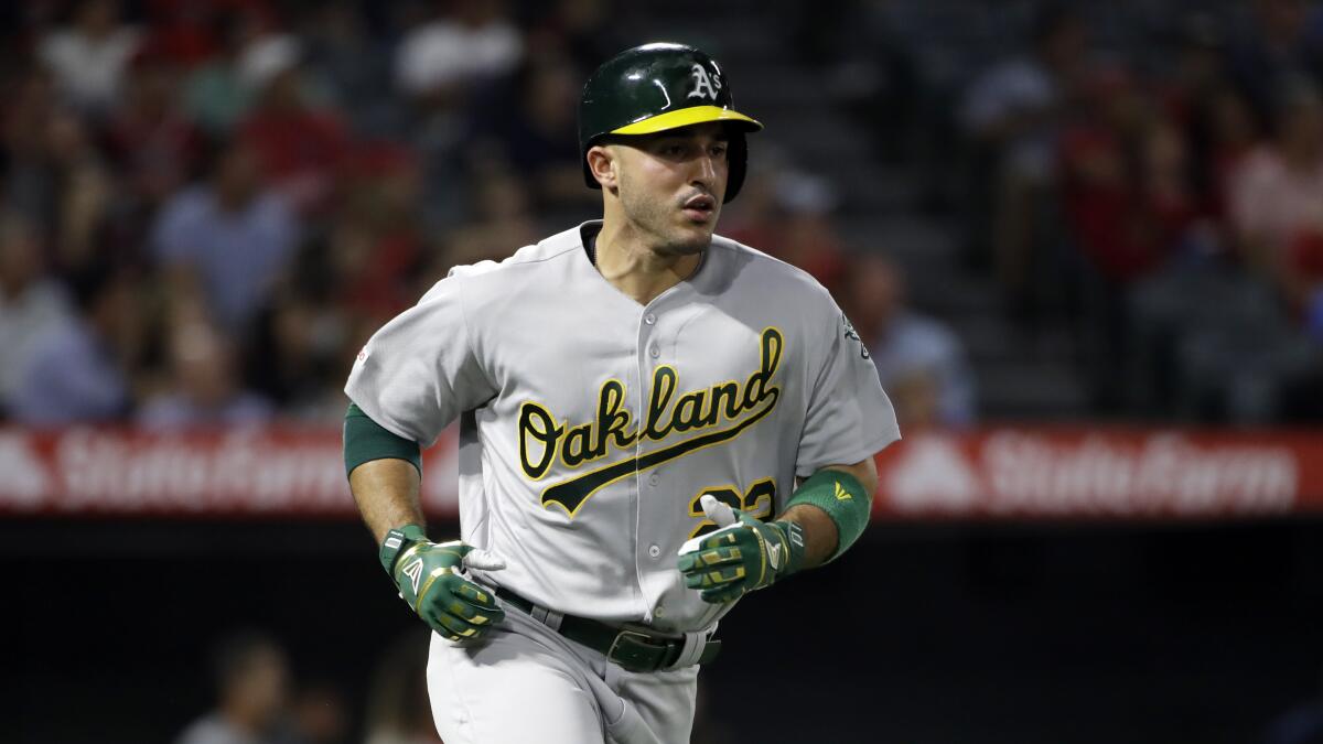 Oakland Athletics' Ramon Laureano runs to first base against the Los Angeles Angels during a baseball game Saturday, Sept. 28, 2019, in Anaheim, Calif. (AP Photo/Marcio Jose Sanchez)