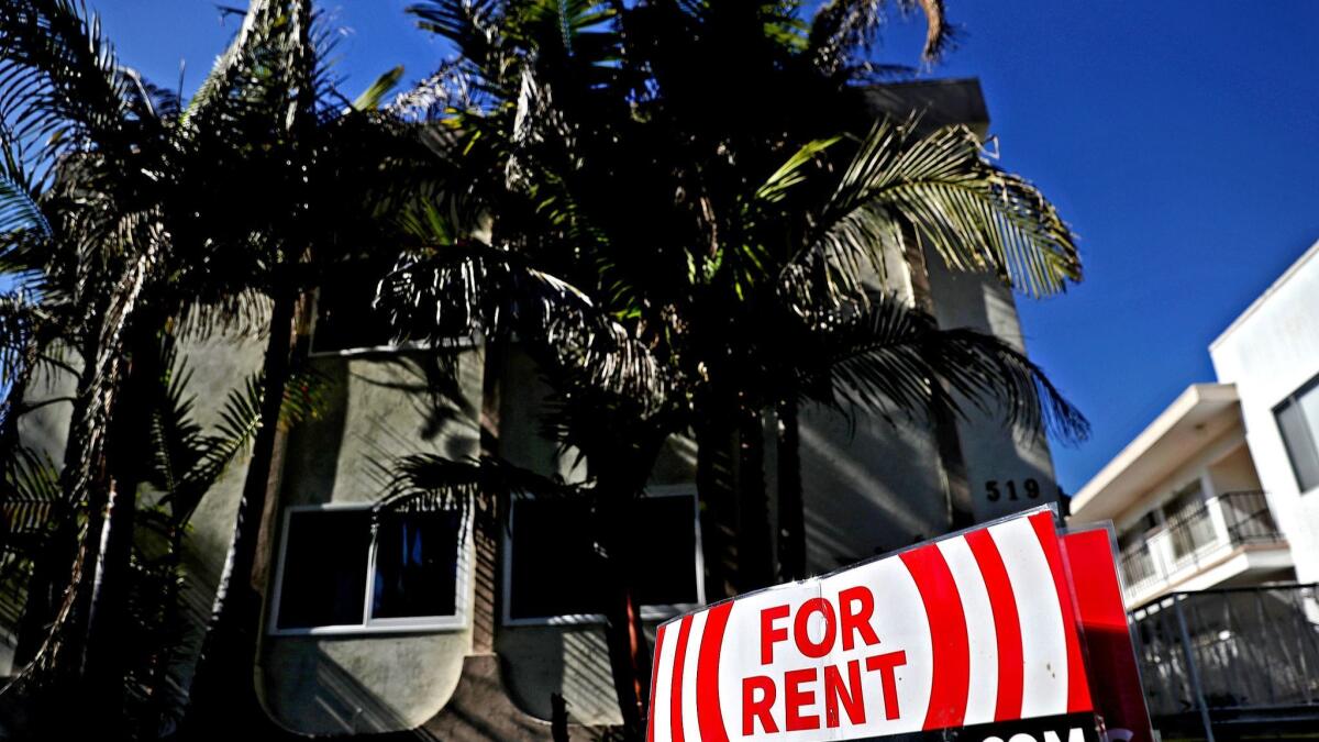 A for-rent sign is posted in front of an apartment building in Los Angeles on Feb. 1, 2017.